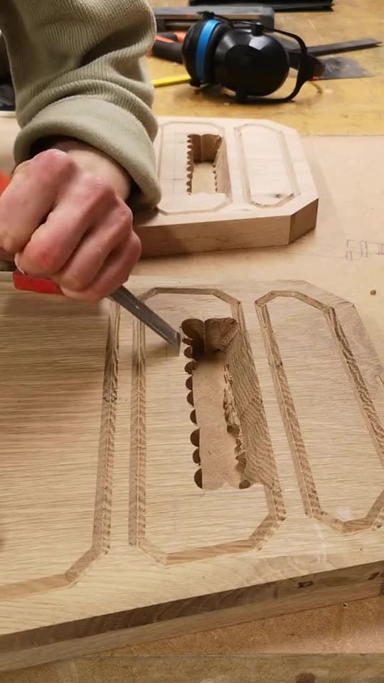 Chiselling the recessed panels of the stool's oak seat