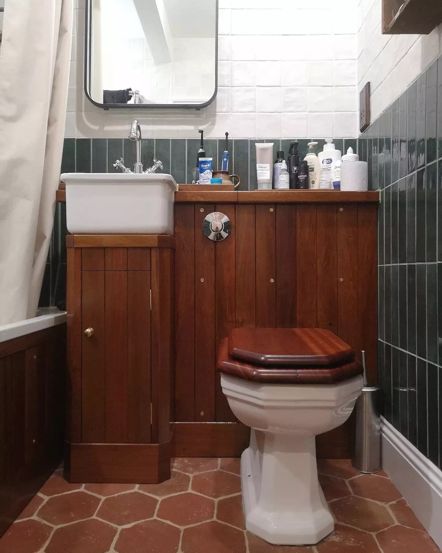 Panelled vanity and cistern housing fitted around a basin