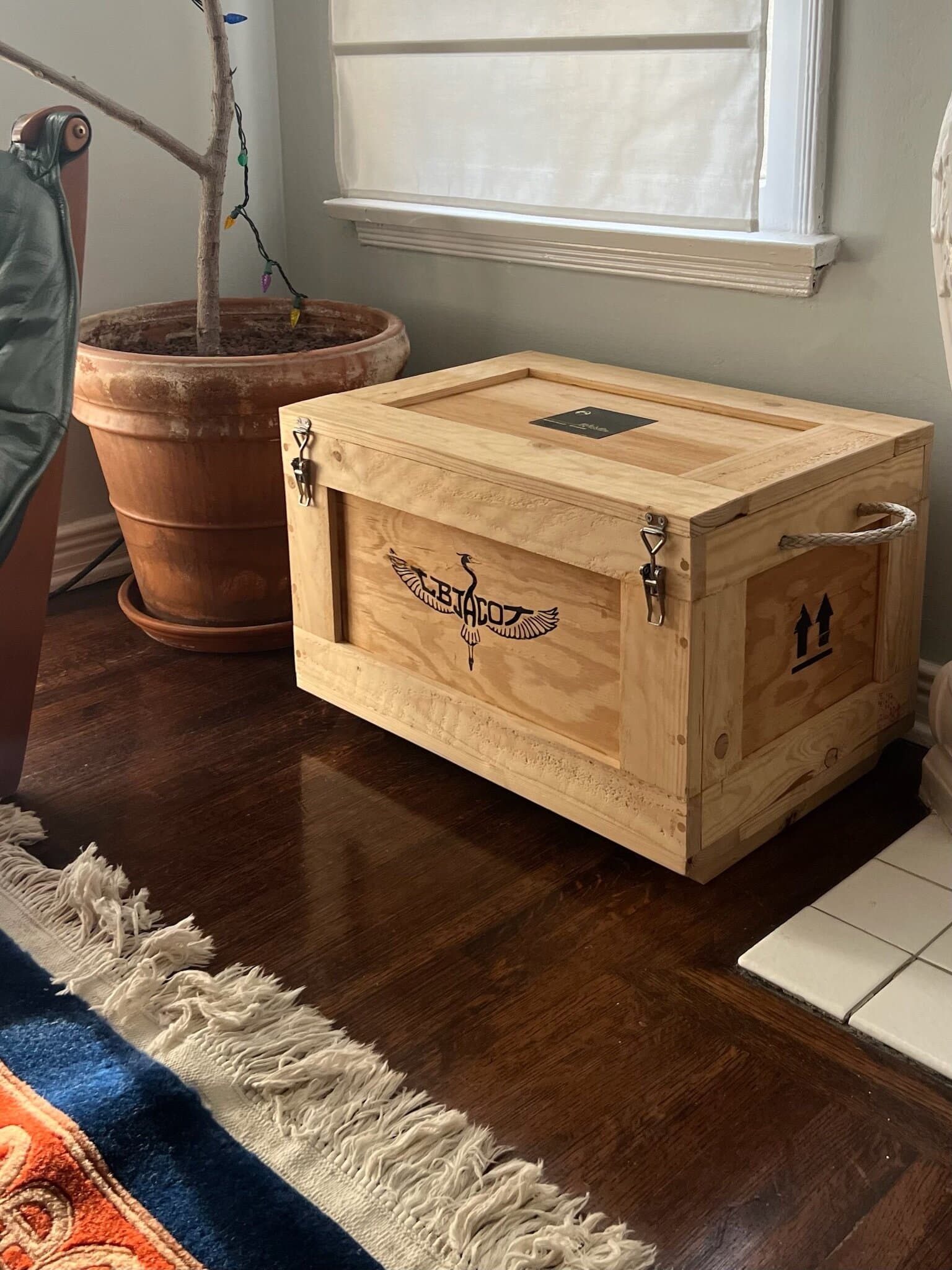 The puzzle box's wooden shipping crate, the L B Jacot heron on its side