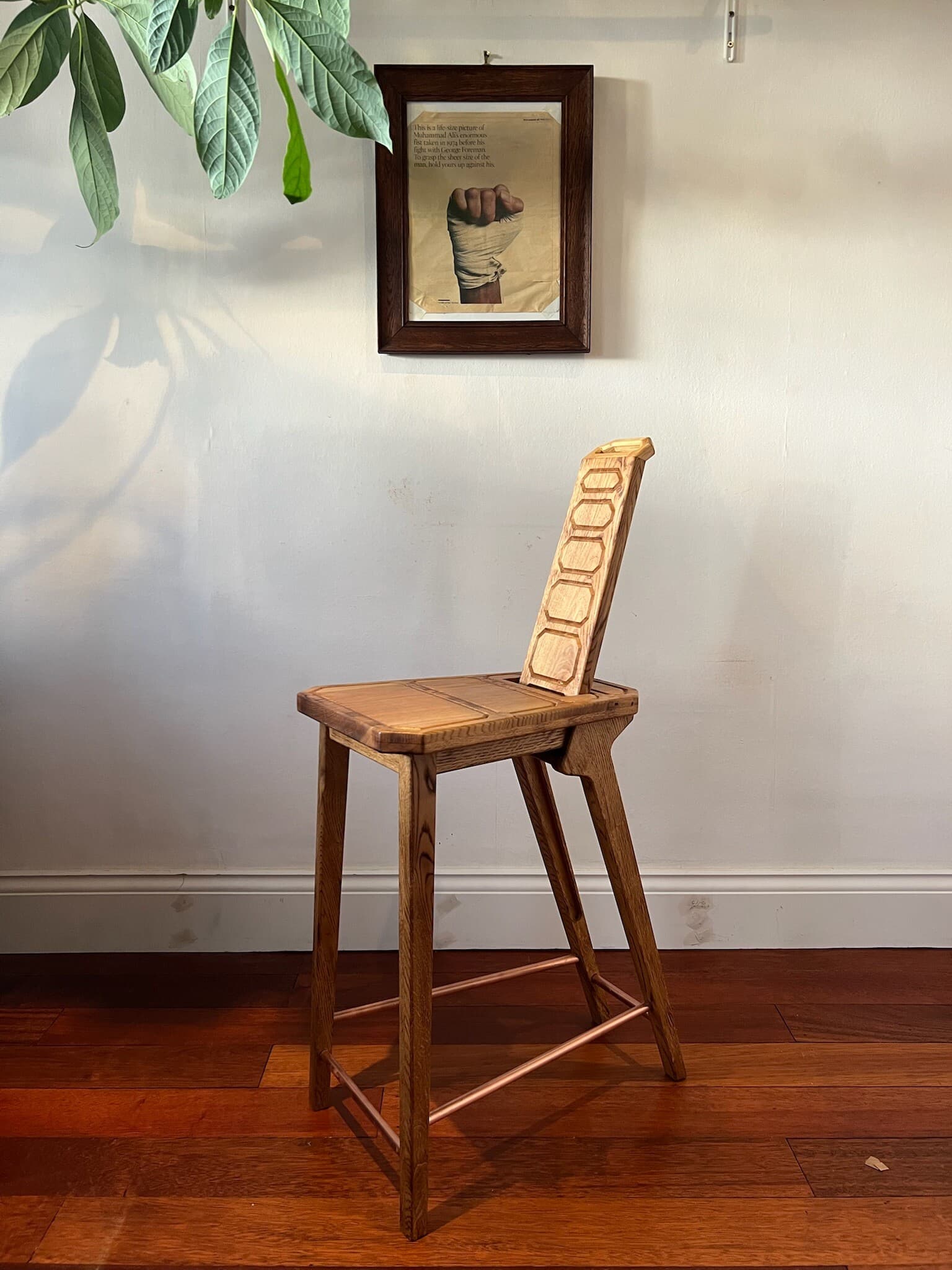 The stool with its backrest slid up through the seat