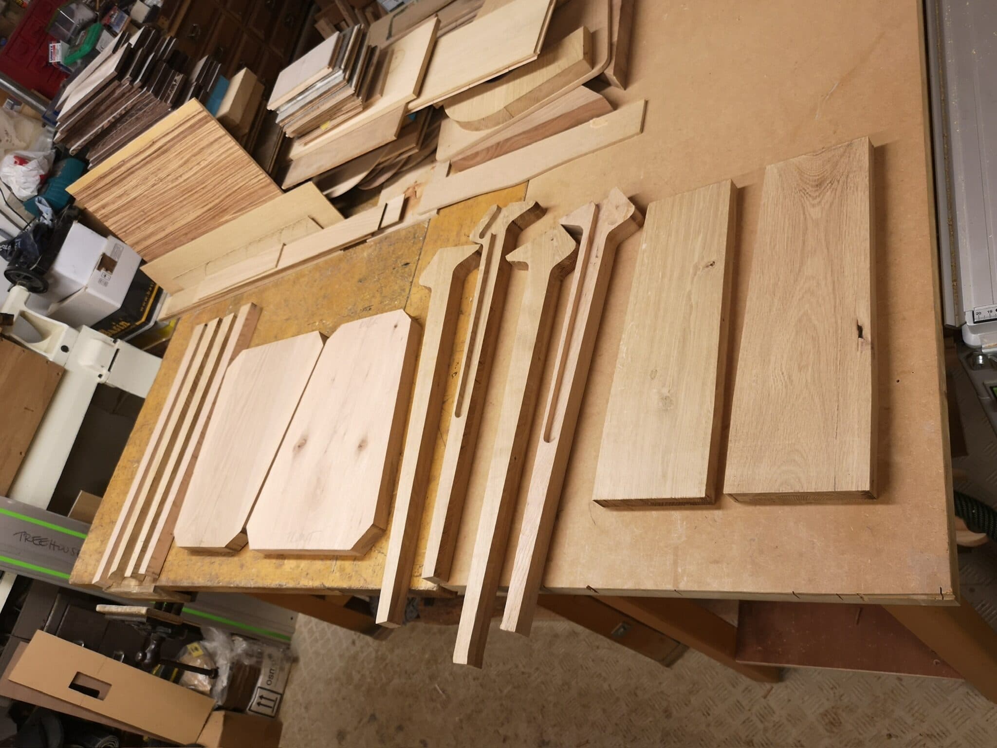 Seat, backrest panels and legs cut out and laid on the bench
