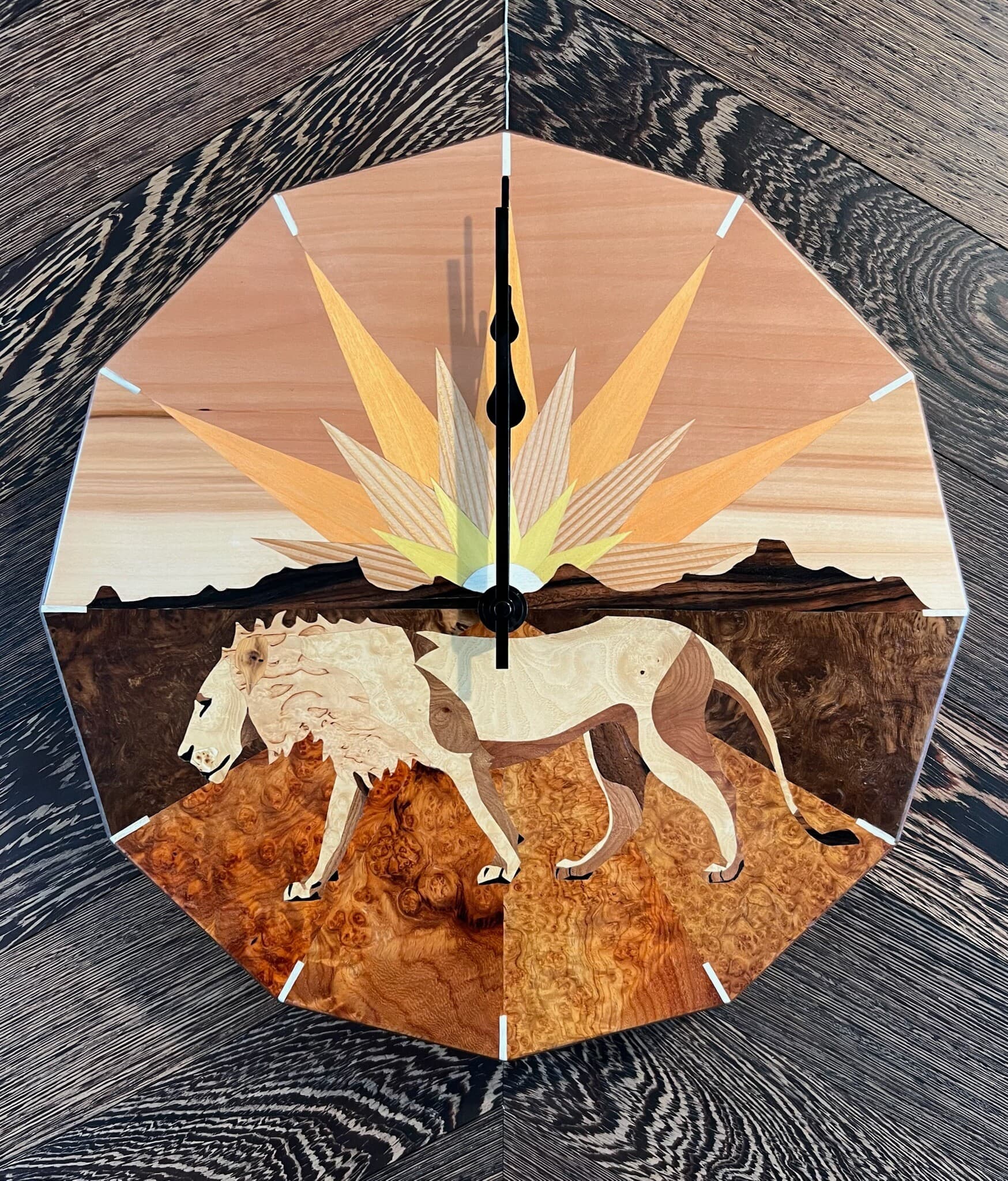 Twelve-sided marquetry clock: a lion walking beneath a sunburst